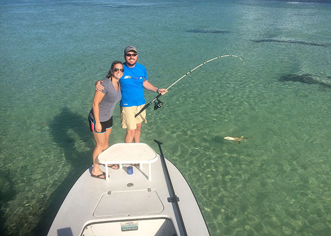 Barbara and her boyfriend pleased about their first time fly fishing in Cozumel.
