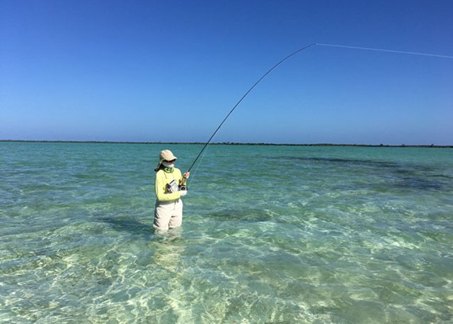 Raquel fly fishing in Cozumel with her friends and family.